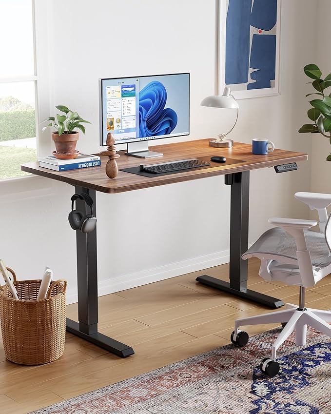 HUANUO 55" x 28" Electric Standing Desk Adjustable Height, 4 Memory Height Settings, Headphone Hook, Cable Manager, Sit Stand Up Desk for Home Office & Computer Workstation, Walnut