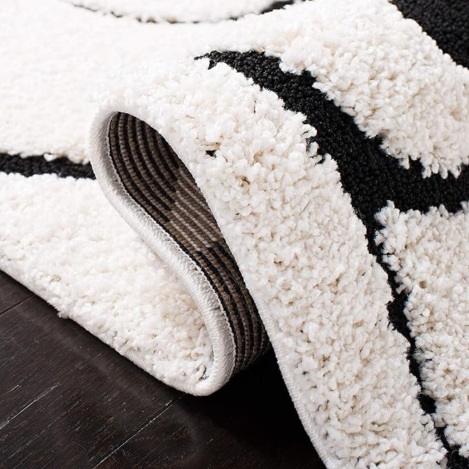 SAFAVIEH Florida Shag Collection Accent Rug - 2'3" x 5', Ivory & Black, Scroll Design, Non-Shedding & Easy Care, 1.2-inch Thick Ideal for High Traffic Areas in Foyer, Living Room, Bedroom (SG455-1290)